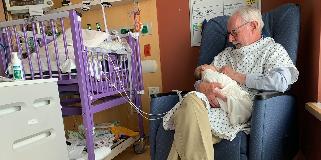 : Volunteers cuddle infants in intensive care: ‘To truly feel their finger curl around yours is an improbable connection.’