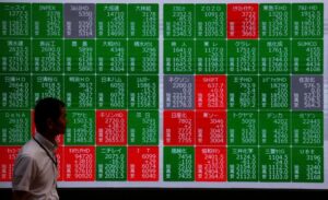 Asia shares trudge as markets reprice Fed expectations, oil gains