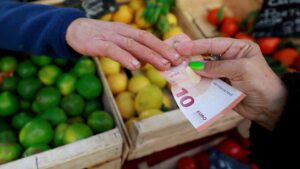 Euro slides to 17-month low towards dollar